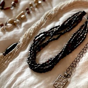 selling as lot of 12 Silpada necklaces in excellent condition. neutral tones.